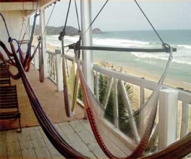 Relax on your balcony overlooking the beach